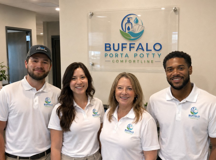 The Buffalo Porta Potty Comfortline team of four in branded white polos in front of the store's wall sign
